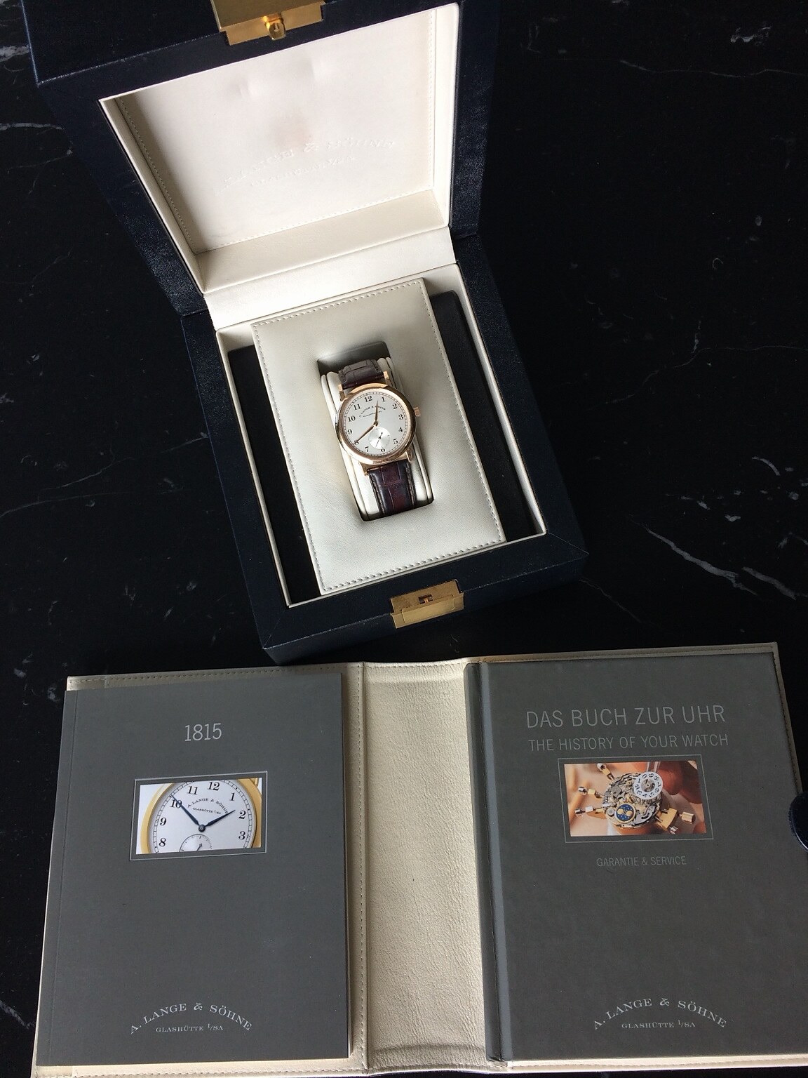 Watch presented with its box and documentation